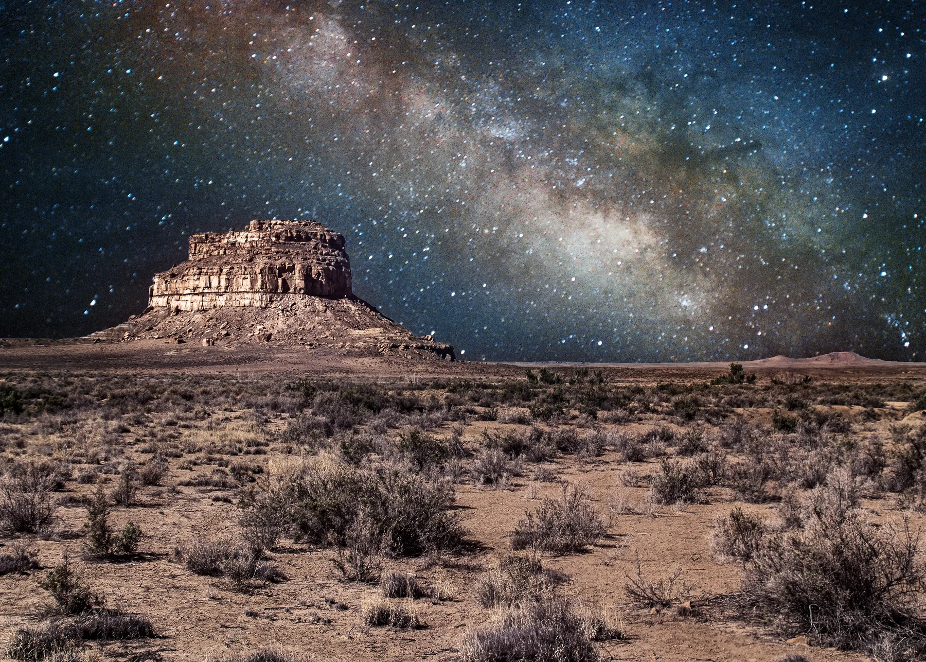 Fajada Butte in Chaco Canyon beneath a star-filled night sky and the Milky Way